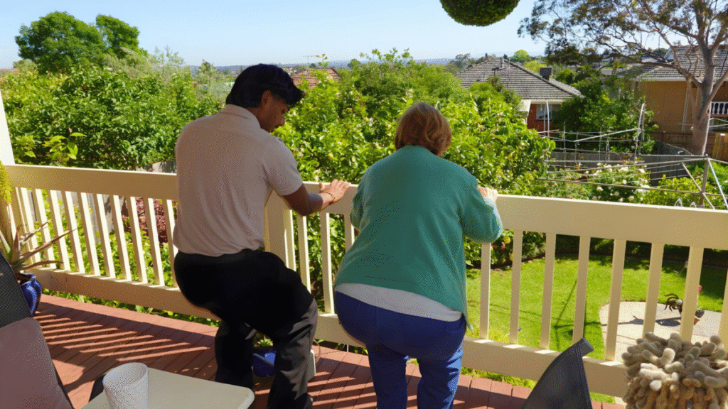 Mobile Physiotherapist doing a squatting exercise with a patient at their home in Melbourne