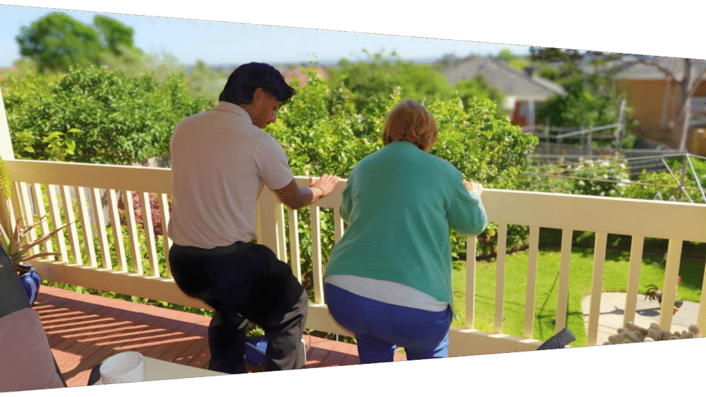 Mobile Physiotherapist in Melbourne doing standing squats exercise with patient at their home